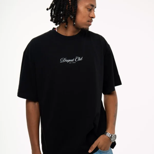 Front shot of model Flacko wearing Dropout's Hangover oversized Black T-shirt while looking away