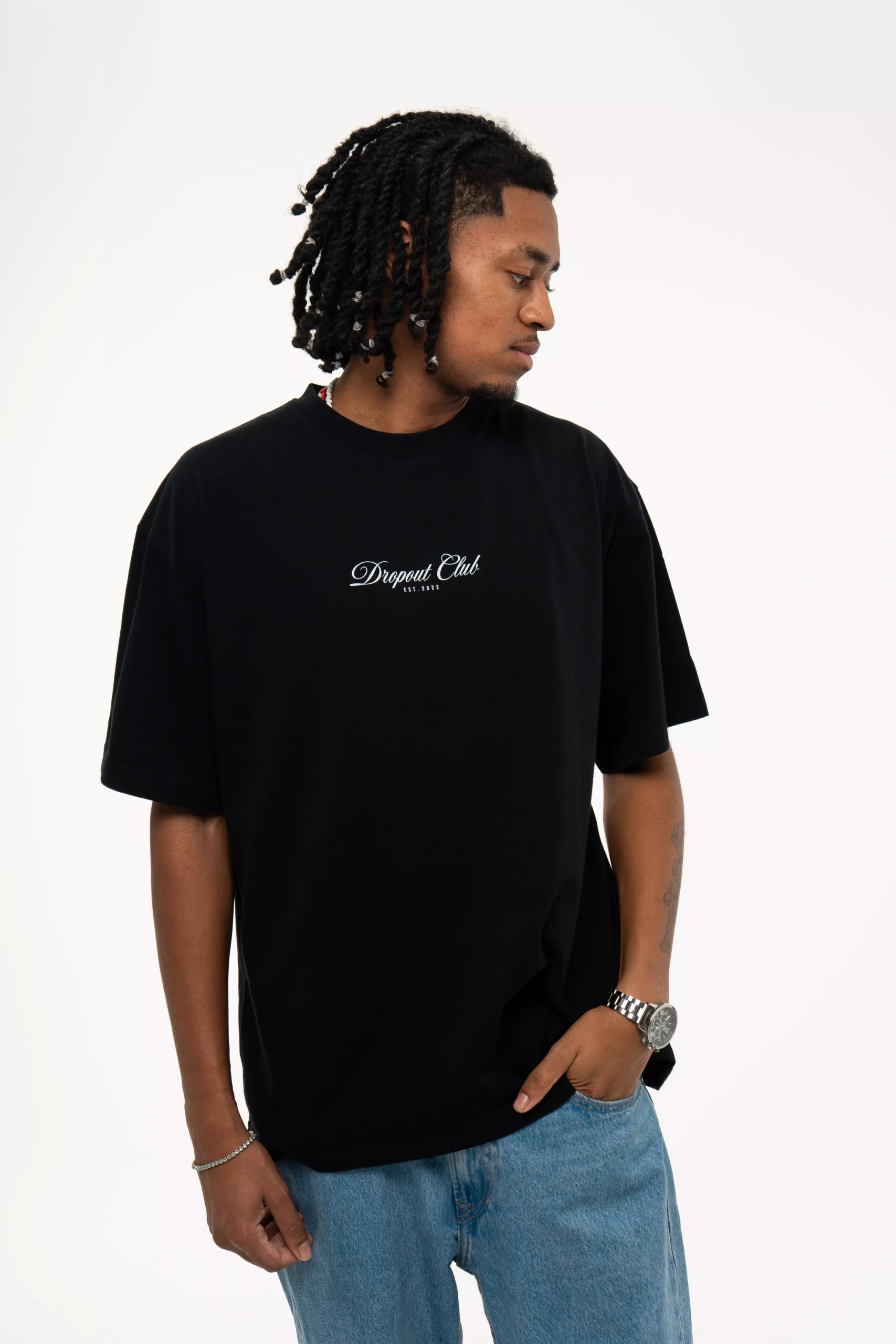 Front shot of model Flacko wearing Dropout's Hangover oversized Black T-shirt while looking away