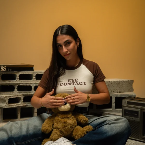 Beatriz wearing Dropout Eye Contact Top to cover the bear's eyes