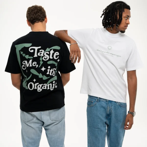 Photograph of two Dropout models, Flacko with his arm resting on Gustavo's shoulder wearing the Organic Taste White T-shirt from the front and Gustavo wearing the Organic Taste Black T-shirt from the back.