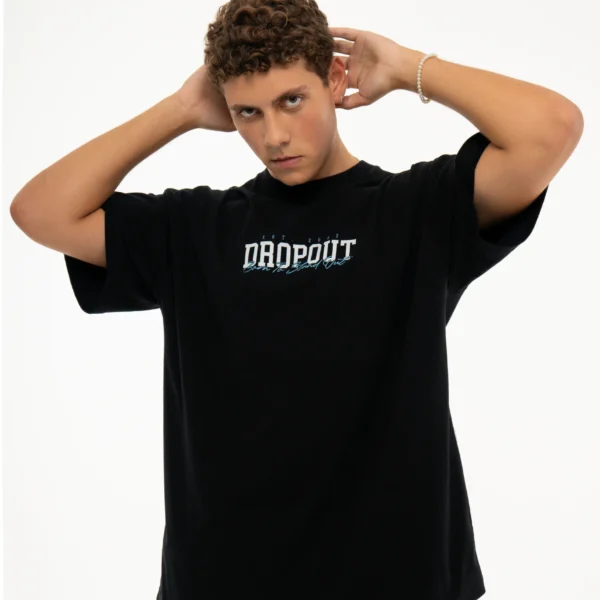 Front shot of Dropout model wearing Teddy Bear Streetwear T-shirt with both hands on her head