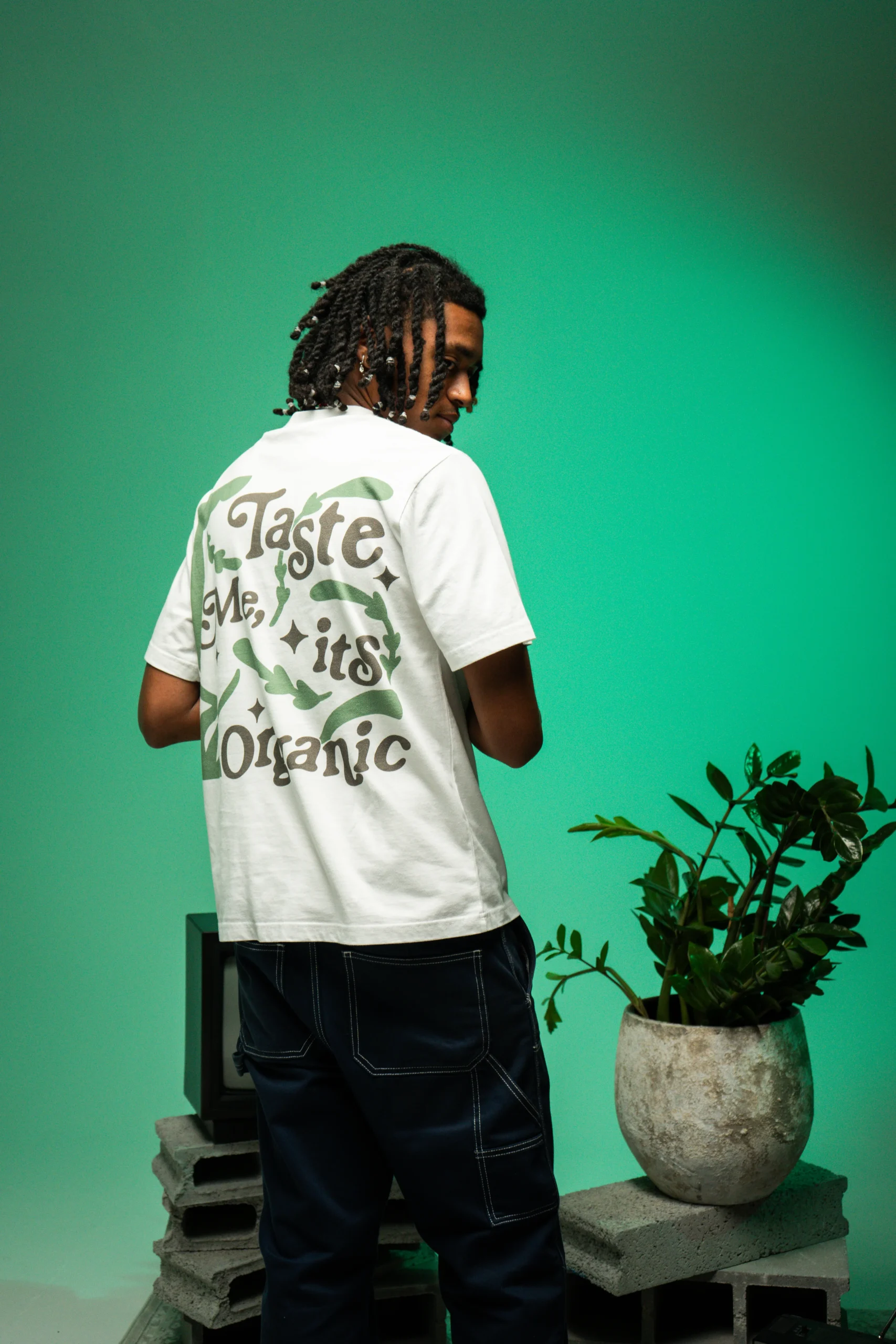 Flacko wearing Dropout's Organic Taste White T-shirt with his back turned